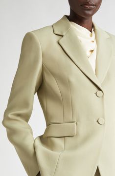 This tailored-fit blazer made from a wool-enriched crease-resistant fabric is framed by signature structured shoulders. 27" length (size 8US/40FR) Two-button closure Notched lapels Chest welt pocket; front flap pockets Side vents Lined 86% viscose, 14% wool Dry clean Made in Italy Designer Clothing Designer Single Breasted Office Suits, Designer Single Breasted Blazer For Formal Occasions, Elegant Structured Blazer With Lapel Collar, Designer Single Button Formal Blazer, Elegant Structured Semi-formal Blazer, Fitted Blazer With Structured Boning For Spring, Structured Formal Blazer, Elegant Structured Blazer With Concealed Placket, Formal Structured Blazer