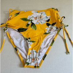 Cupshe Bathing Suit Bottom Super Cute To Wear To The Pool Or Beach. Nwt Has Hygienic Protection Still On. 2 Side Tie-Ups. Color: Yellow, White, Green Floral. Size: Xs Comes From Smoke/Animal Free Home. Fast Delivery. Yellow Stretch Swimwear With Floral Print, Spring High-waist Yellow Swimwear, Yellow High Waist Summer Swimwear, Yellow High-waist Summer Swimwear, Yellow Floral Print Beach Bottoms, Fitted Mustard Bottoms For Beach, Yellow Stretch Swimwear For Spring, Yellow Lemon Print Bottoms For Summer, Yellow Summer Bottoms For Brunch