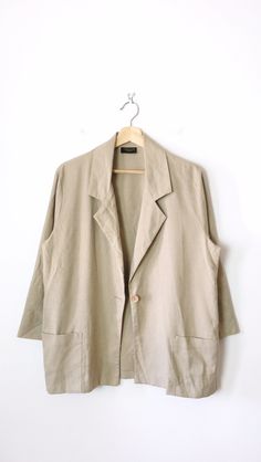 "Vintage Women's Ecru Slouchy Light Blazer/Minimal Jacket. Measurements Length : 28\" Armpit to armpit : 21\" Shoulder: 16 1/2\" Shoulder to end of sleeve: 20\" Condition: Gently used. There's no stains or holes. Good condition. ※Please read the policy before you purchase※" Beige Button-up Summer Blazer, Summer Beige Button-up Blazer, Beige Button-up Summer Outerwear, Summer Beige Button-up Outerwear, Beige Blazer With Pockets For Spring, Spring Beige Blazer With Pockets, Beige Linen Blazer With Relaxed Fit, Beige Summer Outerwear With Button Closure, Oversized Beige Outerwear For Summer