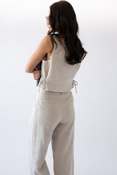 Chic Linen Crop Top For Spring, Spring Linen Tie Back Tops, Spring Linen Tops With Tie Back, Summer Linen Top With Tie Waist, Spring Linen Tie-back Top, Linen Tie Waist Top For Summer, Summer Linen Tops With Tie Waist, Sleeveless Beige Linen Crop Top, Versatile Cropped Linen Tops