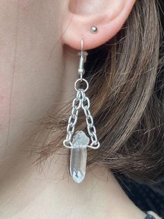 These unique handcrafted earrings are designed specifically for you! Made with natural, raw crystal, they make a perfect statement piece. Clear Quartz is an all around healer. It holds a clarifying nature. Materials: -Thick Silver Chain -Nickel Free Silver Earring Hooks -Raw Clear Quartz Points -20 Gauge Silver Wire Free Shipping on all orders over $35! Handmade in Boone NC with care <3 Follow us on instagram @crystalskydesign for more! Handmade Clear Crystal Dangle Earrings, Metal Dangle Crystal Earrings, Metal Long Drop Crystal Earrings For Gift, Handmade Clear Crystal Drop Earrings, Gift Metal Crystal Long Drop Earrings, Pierced Dangle Crystal Earrings, Nature Materials, Boone Nc, Silver Chandelier Earrings