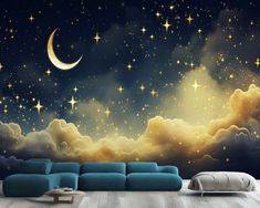 the night sky with stars and crescent moon wall mural is shown in this living room