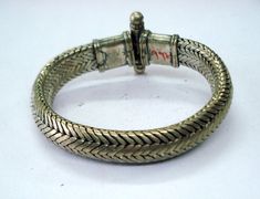 VINTAGE SILVER ROPE CHAIN BRACELET FROM RAJASTHAN INDIA, GREAT HANDMADE SNAKE DESIGN BRACELET, GOOD FOR JEWELLERY COLLECTION. Note - Please check pictures care fully for more detail.length - 20.5 cm(8 inch) we can adjust the length. width - 13 mm weight - 114 grams material - silver. Traditional Snake Shape Jewelry Gift, Vintage Oxidized Bracelets For Festivals, Vintage Oxidized Finish Bracelets For Festivals, Handmade Metal Snake Chain Jewelry, Handmade Metal Jewelry With Snake Chain, Traditional Adjustable Engraved Braided Bracelets, Traditional Engraved Adjustable Braided Bracelets, Traditional Adjustable Engraved Braided Bracelet, Heavy Adjustable Metal Bracelet