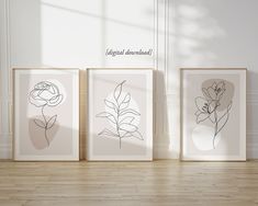 three framed art pieces on a wooden floor in front of a white wall with the words, elegant flowers