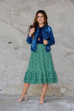 We cannot get over how stylish this skirt is! The fun print and ruffle bottom accents make this such a cute, elegant look! Wear this skirt to any event and you are sure to receive compliments! We love tucking a blouse into this for a more elevated look or a basic or graphic tee for a casual feel!Machine wash with cold water. Do not bleach. Lay flat to dry. Made in the U.S.A. Green Polka Dot Skirt Outfit, Green Polka Dot Skirt, Polka Dot Skirt Outfit, Dot Skirt Outfit, Tie Waist Dress, Green Polka Dot, Polka Dot Skirt, Dot Skirt, Green Skirt