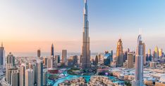 an aerial view of the burjt and surrounding skyscrapers in dubai, united kingdom