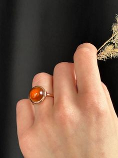 This modern take of cocktail ring is captivating with its honey warm hessonite garnet. Wear it for an iconic, style defining presence.  Known as a Stone of Whole Harmony, this ring harmoniously will match any look. Hessonite garnet cabochon 12 mm 9K solid rose gold Follow us on Instagram: https://www.instagram.com/missionewyork/ Sphere Ring, Silk Bracelet, Gold Statement Ring, Hessonite Garnet, Handmade Fine Jewelry, Solid Gold Chains, Gold Silk, Woven Bracelets, Iconic Style