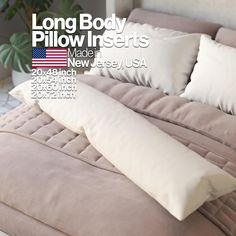 a bed with two pillows on it and the words long body pillow inserts made in new jersey, usa