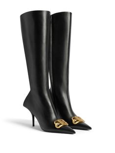 black calf leather smoothing finish gold-tone logo lettering pointed toe side zip fastening high heel Luxury Knee-high Boots, Luxury Calf Leather Knee-high Boots, Luxury Calf Leather Knee-high Heeled Boots, Designer Knee-high Heeled Boots For Work, Luxury Pointed Toe Workwear Boots, Luxury Pointed Toe Work Boots, Luxury Calf Leather Knee-high Evening Boots, Luxury Knee-high Boots With Reinforced Heel, Luxury Knee-high Boots With Reinforced Heel And Pointed Toe