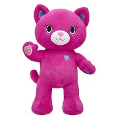 a pink teddy bear with hearts on it's chest and eyes, standing upright