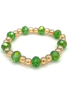 Kaleigh's Collection:  Green and gold color go so well together and this bracelet shows how pretty it is. Large 10mm green glass faceted beads have been combined with 6mm golden glass beads and the combination is appealing. These shiny beads have been strung on sturdy stretch elastic. This lovely bracelet is a delight and will add just enough sparkle to your day. A one of a kind. Gold Bangle Crystal Bracelet For Friendship, Gold Crystal Bangle For Friendship, Gold Hand-strung Crystal Bangle Bracelet, Adjustable Gold Bracelets With Faceted Beads, Adjustable Gold Crystal Bracelet With Round Beads, Elegant Green Beaded Bracelets For Friendship, Gold Beaded Bracelets With Faceted Beads For Friendship, Gold Stretch Bracelet With Faceted Beads, Adjustable Green Bracelets With Gold Beads