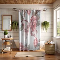 a bathroom with a shower curtain, rug and mirror on the floor in front of it