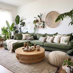 a living room filled with lots of green furniture and plants on top of a rug