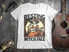 Resting Witch Face Guitar T-Shirt, Funny Witch Playing Guitar Tee, Mindfulness Gift, Vintage Witch Shirt, Halloween Gift. Get hold of this fun Witchy Music Tee for mindful musicians. Vintage-style witch shirt perfect for guitarists and empowered women. Strum some enchanting tunes! ️️ Check out my free guide/course about how to live a Chill, Connected, & Rewarding Life and more of my self-improvement videos at YouTube.com/@Zeke_Kamm Please note: These are custom printed when you make the order so Halloween Band Logo T-shirt, Witchy Music, Resting Witch Face, Funny Witch, Witch Face, Vintage Witch, Music Tees, Halloween Gift, T Shirt Funny