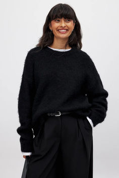 Wool Blend Oversized Sweater Chic Black Sweater With Relaxed Fit, Chic Black Relaxed Fit Sweater, Chic Black Crew Neck Sweater, Winter Black Sweater With Ribbed Neckline, Relaxed Fit Black Ribbed Sweater, Black Ribbed Sweater With Relaxed Fit, Black Ribbed Relaxed Fit Sweater, Black Ribbed Neckline Sweater For Winter, Chic Black Sweater With Ribbed Cuffs