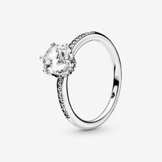 Bring an explosion of sparkle to your outfits with the sterling silver Clear Sparkling Crown Ring.  The claw setting of the large clear cubic zirconia creates the effect of a regal crown on the solitaire ring and is complemented by additional small stones set along the ring band. A ring that’s fit for the special princess or queen in your life, it can be paired with most other selections from the Pandora collection for a truly regal look. - Pandora Clear Sparkling Crown Solitaire Ring - Sterling silver / Cubic Zirconia / Clear - Sz. 8.5 Pandora Collection, Claw Setting, Pandora Rings, The Claw, Crown Ring, Jewellery Uk, Small Heart, Ring Band, Lab Created Diamonds