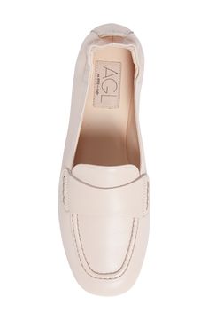 An elasticized topline softens the sophisticated appeal of a supple leather loafer with a moc-stitched toe. Leather upper and lining/leather and rubber sole Made in Italy Women's Shoes Office Slip-ons With Rubber Sole, Formal Beige Slip-ons For Spring, Slip-on Loafers With Rubber Sole For Work, Slip-on Work Loafers With Rubber Sole, Slip-on Flat Shoes For Work, Formal Swift Leather Slip-ons With Round Toe, Flat Slip-ons For Workwear, Flat Slip-ons For Work, Workwear Slip-on Loafers With Rubber Sole