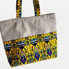 This cute colorful Tote bag will add style to any clothing and get ready for compliments.  It's handmade from a combination of plain color and bright multicolored  Cotton African  fabric which makes it unique and it will stand out. The bag measures approximately width 17 inches height 14 inches. The inside is lined and the Tote has a zipper to close.The bag has room to hold anything you may need. Large Capacity Yellow Box Bag For Everyday Use, Casual Multicolor Pouch Beach Bag, Casual Rectangular Bag With Zipper Pouch, Yellow Travel Bag With Zipper Pouch, Multicolor Zipper Pouch Bag For Daily Use, Multicolor Pouch Box Bag For Daily Use, Multicolor Daily Use Bag With Zipper Pouch, Yellow Everyday Bag With Zipper Pouch, Multicolor Rectangular Beach Bag With Removable Pouch