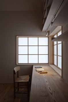 an empty room with a desk and chair