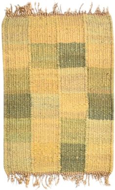 a yellow and green checkered rug with fringes on the bottom, in front of a white background