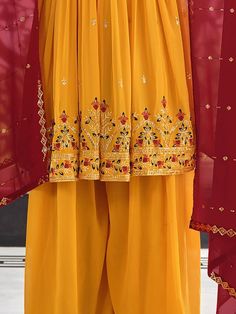 Make your next ceremony or function unforgettable with the Ravishing Mustard Sequins Georgette Ceremony Wear Salwar Kameez. This stunning suit features intricate thread embroidery and sequin work, all set against a beautiful mustard yellow georgette fabric. You'll love the included similar color palazzo and the deep red dupatta, both of which feature the same embellishment as the suit itself.
Not only is this suit breathtakingly beautiful, but it's also incredibly comfortable to wear. It's made Festive Gold Georgette Palazzo Set, Yellow Chinon Traditional Wear With Intricate Embroidery, Yellow Salwar Kameez With Intricate Embroidery, Yellow Chinon Dupatta With Intricate Embroidery, Festive Yellow Anarkali Set With Intricate Embroidery, Gold Palazzo Set With Dabka Work In Georgette, Designer Yellow Salwar Kameez With Mirror Work, Festive Yellow Salwar Kameez With Mirror Work, Gold Georgette Palazzo Set For Diwali