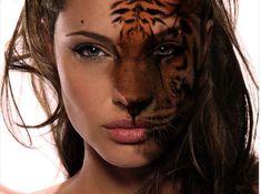 a woman's face with a tiger painted on her face and the image of a tiger behind her