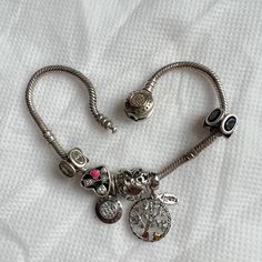 Pandora Snake Chain Bracelet Comes With Six Charms, Black And White Cz, Heart, Pandora With Cz, Heart (Wife), Family Tree With Green Gems And A Gold Heart. It’s Been Preloved So It Is Tarnished But It Can Also Be Cleaned It Goes For All Ss925. -I Follow Poshmark’s Return Policy Guidelines So Be Sure To Ask Questions Before Purchases. All My Items Has Been Preloved And Worn Otherwise If Stated Nwt. Pandora Family, Snake Chain Bracelets, Green Gems, Pandora Bracelet, Gold Heart, Heart Of Gold, Snake Chain, Family Tree, Womens Jewelry Bracelets