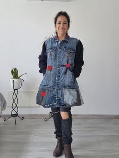 "It is made with the use of jacket, cotton pants, denim and flannel, it is a short coat with pockets on the top of the breast, it is decorated with red flowers and hearts and painted flowers. This coat is totally recycled with materials of little use, so it could last you even longer. My goal is to help nature to regenerate itself by using materials that can still last for a long time, thus avoiding the ''use and discard'' fashion.  This coat-jacket is ready to be shipped all over the world. It is a nice, loose-fitting coat that you could wear it for different occasions. Recycled coat , with metal rings fastened on the right side. All my products, after I finish sewing them, are washed and ironed before shipping MEASUREMENTS The model is size S and is 160 cms tall, as you can see it is a b Army Jacket Upcycle, Upcycled Jean Jacket, Vintage Reworked Clothing, Blanket Upcycle, Upcycle Denim Jeans, Reworked Jacket, Long Denim Coat, Recyceltes Denim, Jacket Patchwork