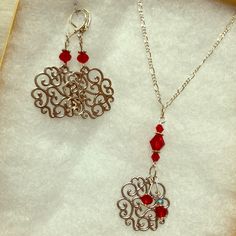 A Gift Set Of Red Crystal And Silver Earrings And Matching Necklace (26” Chain). The Dangling Round Is About 1” Across. Made And Designed With Love By Stella Sherman. See Photos For Details! Red Pendant Earrings For Anniversary, Nickel-free Red Jewelry For Anniversary, Nickel-free Silver Necklaces For Christmas, Red Jewelry With Lobster Clasp For Party, Nickel Free Red Jewelry As Gift, Nickel Free Red Jewelry Gift, Nickel-free Silver Necklace For Christmas, Silver Jewelry With Matching Earrings For Christmas, Red Dangle Jewelry For Christmas