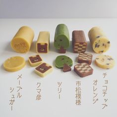 there are many different types of candies on the table with japanese characters written in them