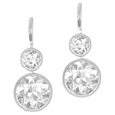 Indulge in elegance with these diamond earrings boasting bezel-set old European cut diamonds. Each earring showcases two diamonds—a larger bottom pair weighing 2.80 carats combined, in L color and VS1 clarity. The top diamonds, weighing 0.51 carats combined, add a touch of brilliance. Meticulously handcrafted in platinum and completed with Euro-backs, these earrings radiate timeless allure. Clarity: VS1 Color: L Color Material: Platinum Stone: Diamond Stone Cut: Old European Total Weight: 5.66 G Classic White Diamond Earrings With Rose Cut, Elegant White Gold Diamond Earrings With Bezel Setting, Platinum Diamond Earrings With Rose Cut Diamonds, Platinum Diamond Earrings With Rose Cut, Platinum Rose Cut Diamond Earrings, Timeless Rose Cut Diamond Earrings, Timeless Rose Cut Diamond Earrings For Formal Occasions, Diamond White Bezel Set Earrings For Formal Occasions, Diamond White Earrings With Bezel Setting For Formal Occasions