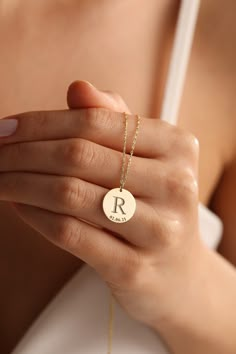 "Here is the super elegant initial necklace. You may design your necklace with any letter and dates as you want. This letter necklace is fully customizable and proper for any combine. This gold letter necklace is one of our favorite design and great gift idea for women. Gold Name Necklace is the most beautiful gift in the world. The easiest way to make a woman happy may be to order her a timeless letter necklace.  This personalized necklace would make a wonderful personalized Christmas gift, birthday gift, anniversary gift. The gold name necklace is a durable solid necklace. First quality materials are used while producing our letter necklaces.  Our chains are produced by hand with a special system. It has a solid form. All our jewelry is %100 custom made by hand with Love and Care in our Minimalist Initial Pendant Necklace As Anniversary Gift, Minimalist Initial Pendant Necklace For Anniversary Gift, Minimalist Initial Pendant Name Necklace For Anniversary, Minimalist Monogram Letter Necklace, Minimalist Monogram Necklace, Minimalist Initials Name Necklace For Anniversary, Initial Pendant Necklace With Letter Print For Gift, Minimalist Customizable Initial Pendant Necklace, Letter Print Initial Pendant Necklace As Gift