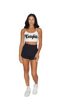 This super flattering UCF Knights White Spaghetti Tank Top is perfect for college game day paired with our UCF Game Day Skirt! One Size Fits Most. 88% Micropoly, 12% Spandex. Stretchy & soft fabric designed for all day use & long lasting quality. Sublimated Design. Machine wash on cold. Officially Licensed by Lo + Jo Bands. Fitted Seamless Activewear For Sports Events, Seamless Fitted Activewear For Sports Events, Sporty Fitted Shorts For Cheerleading, Fitted Short Activewear For Cheerleading, Sporty Fitted Athletic Shorts For Cheerleading, Stretch Athletic Shorts For Sports Events, Fitted Elastane Sports Bra, Casual Style, Fitted Casual Elastane Sports Bra, Casual Fitted Elastane Sports Bra