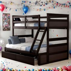 a bunk bed with a pull out trundle underneath it and balloons in the background