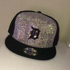 This listing is for one Crystal hat. If hat is a major sports team, the hat used will be licensed.  Any special stone colors or personalization is to be made clear in a message after purchase-- otherwise the hat will be blinged at the artist discretion.  The front of hat will only have crystals (see photo for sample) *If you want a fully blinged hat message me for a custom listing  ** Any questions feel free to message me first, and I will gladly answer any question with detail. Thank you Custom Flat Brim Baseball Cap, Crystal Hat, Bling Hat, Custom Bling, Hat Custom, New Haven, Real Diamonds, Trucker Cap, Sports Team