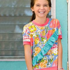 Nwt Matilda Jane Pink & Turquoise Floral Ruffle-Stripe Accent Born To Be Brave Tee Retails For $44 95% Rayon 5% Spandex Machine Wash/Tumble Dry Imported Check Posted Green Lularoe Veggies Listing That Pair Up Well With This Top Sh-4022 Playful Ruffled Tops For Vacation, Playful Pink Ruffled Tops, Playful Ruffled Tops For Beach, Playful Pink Tops For Vacation, Playful Ruffle Tops For Playwear, Playful Ruffled Tops For Playwear, Playful Multicolor Ruffled Tops, Playful Pink Printed Top, Short Sleeve Ruffle Tops For Playwear