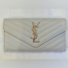 Beautiful Crme Leather Ysl Wallet With Gold Tone Hardware. Authentic In Excellent Condition. No Signs Of Wear. Comes With Her Original Box And Dust Bag. Bags Ysl, Ysl Wallet, Saint Laurent Bags, Yves Saint Laurent Bags, Yves Saint Laurent, Original Box, Saint Laurent, Dust Bag, Bag Lady