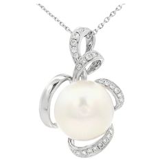 Embrace timeless elegance with this exquisite pendant, meticulously crafted in 18 Karat White Gold. At the heart of this design is a lustrous 13mm South Sea Pearl, renowned for its radiant luster and classic beauty. The pearl's pristine surface and natural glow make it a stunning centerpiece, symbolizing purity and sophistication. This luxurious pearl is gracefully entwined with a delicate swirl of 0.22-carat Diamonds, adding a touch of sparkle that enhances the pendant's overall allure. Each diamond is carefully set to catch the light, creating a mesmerizing effect that draws attention to its intricate design. The graceful curves of the gold setting add a modern twist to this classic piece, making it versatile for both everyday elegance and special occasions. This pendant is perfect for t Pearl Diamond Pendant, Jewellery Pearl, Everyday Elegance, Sea Pearl, South Sea Pearls, Pearl Diamond, Natural Glow, Classic Beauty, Gold Set