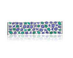 Our Amina Chain Bracelet showcases the brilliant union of green emeralds and violet tanzanite. The stones are set on halos of white diamonds that create a piece of pure luxury.Specifications:9.04 Carat Diamond31.55 Carat Emerald71.89 Carat Tanzanite48.03 Gram 18 Karat White Gold Gemstone Diamond Ring, Emerald Bracelet, Tanzanite Diamond, White Gold Bracelet, Precious Jewels, White Gold Necklaces, Sapphire Bracelet, White Gold Earrings, Rose Gold Bracelet