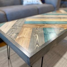 a coffee table made out of wood and metal legs