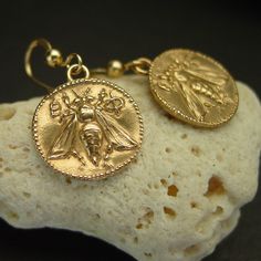 Hand carved honey bee earrings, museum earrings replica of an ancient coin. Images of the bee as a symbol appear very early in the development of ancient Greek coinage. In particular, the prosperous city of Ephesus in Ionia (on the Aegean coast of Turkey) adopted the bee as its civic emblem. Ephesus was the location of a famous temple of the goddess Artemis (one of the Seven Wonders of the ancient world.) The priestesses were called melissae (honeybees). - Hand carved coins - Reproduction of a 3 Engraved Medallion Earrings For Gift, Gold Engraved Symbolic Earrings, Symbolic Engraved Gold Earrings, Engraved Gold Symbolic Earrings, Coin Pendant Earrings As Gift, Coin Pendant Earrings For Gifts, Coin Pendant Medallion Earrings For Gift, Vintage Earrings With Coin Pendant For Gift, Vintage Coin Pendant Earrings For Gift