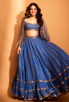 This set features a full sequin copper hand-embroidered lehenga with blouse and mirror border dupatta. Fabric: Dupatta - Net; Blouse - Georgette Color: Blue Care: Dry Clean Only About the Designer ... Dull Blue, Lehenga With Blouse, Vani Vats, Chaniya Choli Designs, Mirror Border, Net Blouse, Simple Lehenga, Latest Bridal Lehenga, Indian Outfits Lehenga