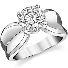 a white gold ring with a diamond in the center