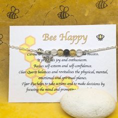 "(Gift wrap available at check out) If you need more than 1 gift wrap, please buy them separetly in my shop. You'll find the option under the section \"Gift Wrap\") 🐝 Bee Happy bracelet, perfect for yourself  or as gift!! 🐝 Ideal for any occasions!! 🐝 All my crystals are natural in order to preserve all their qualities. These crystals have been chosen and put together based on their qualities to promote calm and relax. About the Gemstones: Citrine Tiger Eye Clear Quartz  Citrine: attracts wea Spiritual Beaded Bracelets For Mother's Day Gift, Inspirational Silver Beaded Bracelets As Gift, Spiritual Charm Bracelet With Natural Stones For Gift, Spiritual Crystal Bracelet With Gemstones As Gift, Spiritual Crystal Gemstone Bracelet Gift, Spiritual Charm Bracelet Gift, Handmade Inspirational Beaded Bracelets As Gift, Inspirational Handmade Beaded Bracelets As Gift, Spiritual Charm Bracelet For Mother's Day Gift