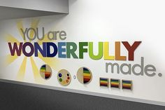 a sign that says you are wonderfully made on the side of a wall in an office