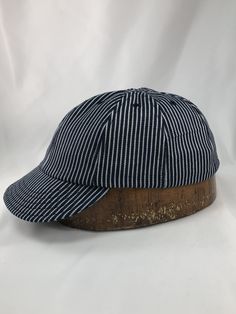 Now, our classic 8 panel shallow cut cap is available in Herringbone denim or Hickory stripe denim. This classic style and fit our sure make this your favorite hat. The more you wear our caps the more comfortable they are. Experience what it's like to own a custom made Cap from Stockbridge sewing works! Classic 5-panel Hat, Adjustable Striped Baseball Cap, Striped Cotton Cap, Classic Striped Adjustable Hat, Classic Adjustable Striped Hat, Casual Striped Adjustable Baseball Cap, Striped Cotton Hat With Curved Brim, Two Heads, Custom Caps