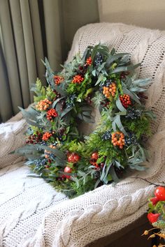 a christmas wreath sitting on top of a couch