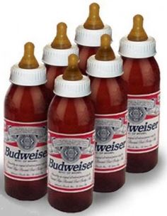 six bottles of budweiser are lined up