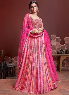 Elevate your style with our exclusive pink sequins and embroidered lehenga choli for women! Made with luxurious chinon silk, this readymade outfit is perfect for any Indian party or wedding. Be the center of attention with our stunning bridesmaids lehenga, designed to make you look and feel your best! The unstitched blouse can be customized upto 46 inches. Do Note: All the accessories shown are for styling purpose only. Slight color variation may occur due to photographic reasons. Occasion : Wed Bridesmaids Lehenga, Lehenga Pink, Lehenga Indian, Lehenga Choli Designs, Ghaghra Choli, Lehenga Choli For Women, Silk Lehenga Choli, Bridesmaid Lehenga, Choli For Women