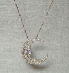 Note : Item Comes With Chain. Specification:- Stone Details :-  *Diamond Material : Cubic Zirconia (CZ) *Diamond Shape : Round Cut *Pearl Dimension : 4.50, 5.00, 5*8 MM  *Diamond Dimension : 0.90, 1.00, 1.10, 1.20, 1.30, 1.40, 1.50, 1.60, 1.80, 2.10 MM  *Diamond Weight : 1.99 CT  *Diamond Color : White *Clarity : VVS *Making Process: Handmade by our Experienced Staff. *Stamp: Our All Pendant Stamped According to metal Purity (925 SIL/10K/14K/18K).  Procedure information Please select the materia Round Moon Charm Jewelry For Party, Celestial Round Jewelry For Parties, Crescent Moon Charm Party Jewelry, Crescent Moon Charm Jewelry For Parties, Elegant Diamond Moon Phase Jewelry, Elegant Handmade Half Moon Necklace, Elegant Handmade Half Moon Jewelry, Celestial Silver Necklace For Party, Fine Jewelry With Moon Charm For Wedding